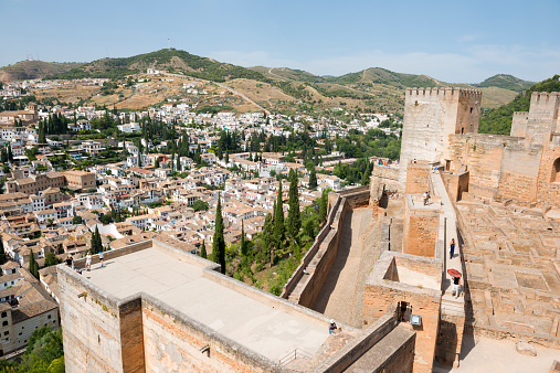 Granada, Spain - June 11, 2014: People explore the Alcazaba fortress of Alhambra in Granada, Spain