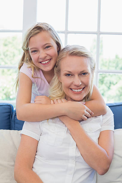 istock Cute girl embracing mother from behind 468892318