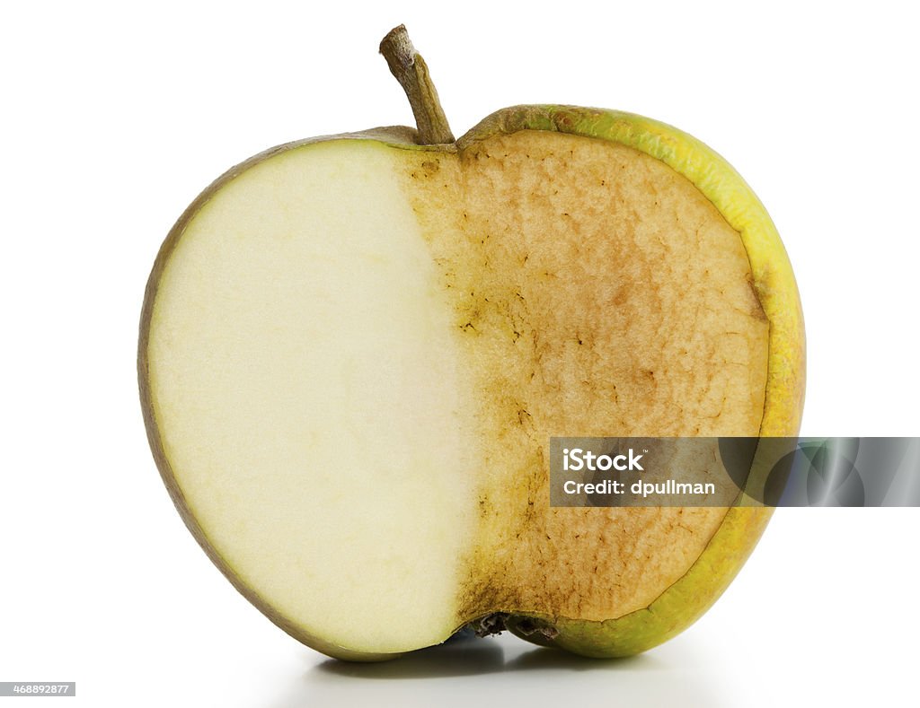 Apple Fresh and Decayed Apple sliced in half. Half fresh and half decayed on white background Apple - Fruit Stock Photo