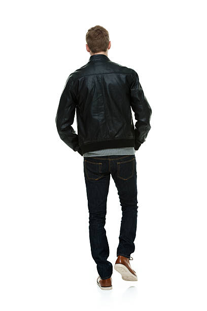 istock Rear view of casual man walking 468893100