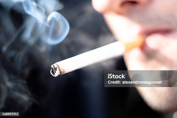 Smoking Cigarette Stock Photo - Download Image Now - Addict, Addiction, Adult
