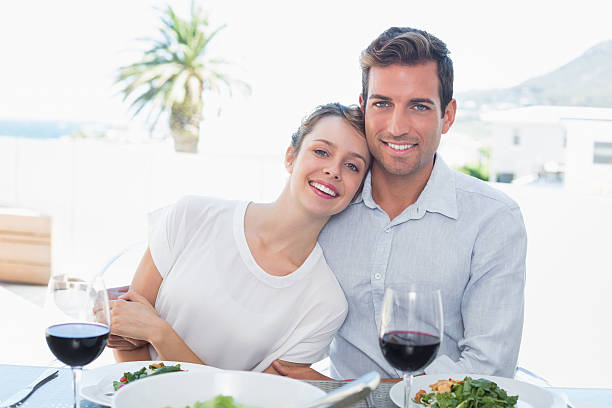 istock Loving couple with wine glasses at lunch table 468896038