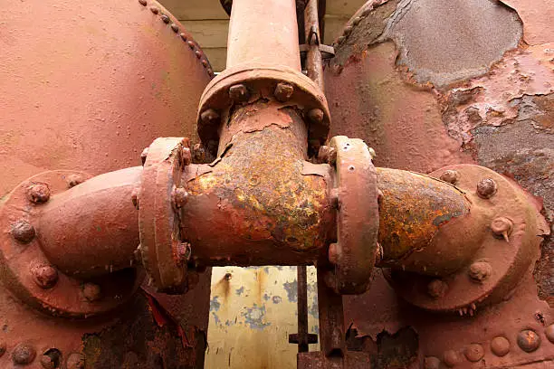 Severe rusting of tanks and pipework of disused foghorn equipment at the lighthouse at Sumburgh Shetland Islands