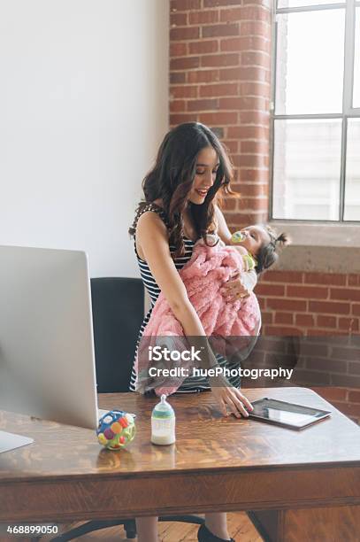 Working Mother Stock Photo - Download Image Now - 2015, Adult, Baby - Human Age