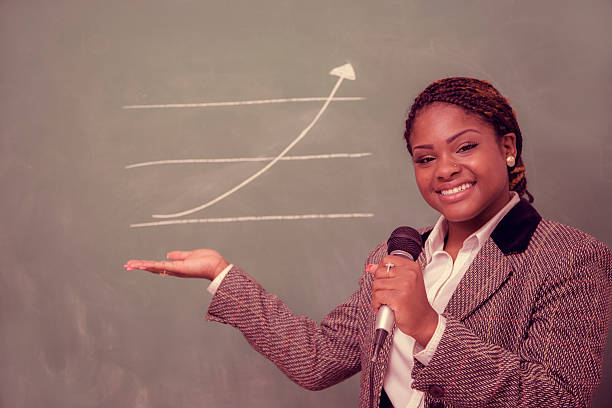 istock Business: African descent businesswoman draws chart, arrow. 468899325