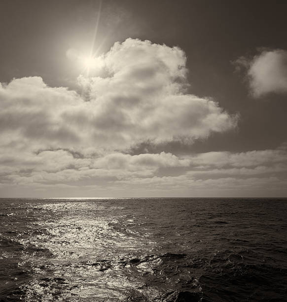 istock Sea and sun on dark cloudy sky 468899962