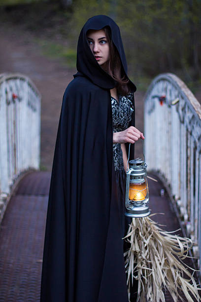 istock girl with a lantern on the bridge 468900224