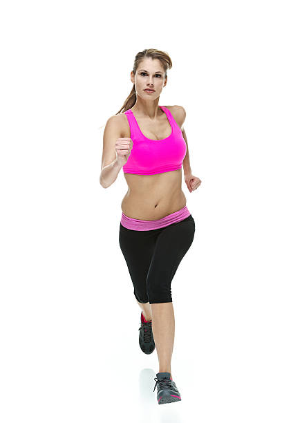 istock Attractive female in exercise clothing and running 468900766