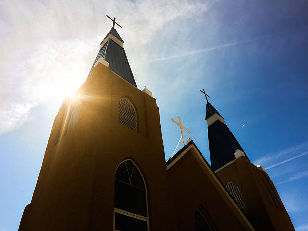 istock church and sunshine sky with crosses 468903776