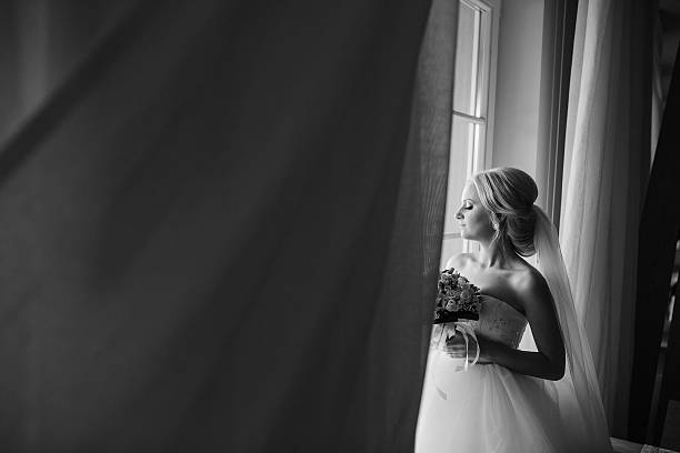 istock blonde bride with her groom 468903806