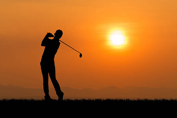 istock Silhouette of golfer against sunset 468906326