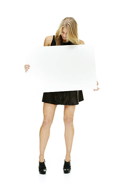 istock Beautiful woman holding placard 468906572