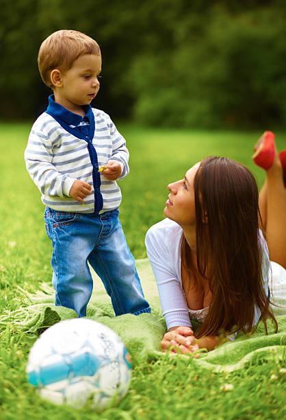 istock Cute small boy standing with his mother 468906697