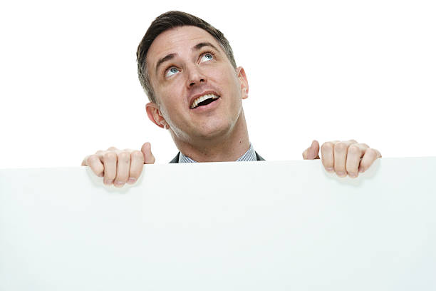 istock Businessman holding placard and looking away 468906726