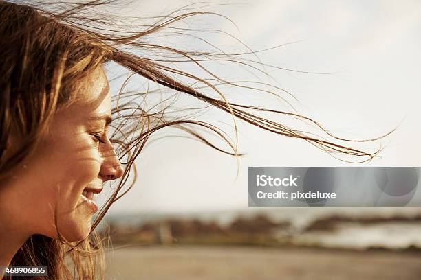 Enjoying The Fresh Sea Air Stock Photo - Download Image Now - Women, One Woman Only, Wind