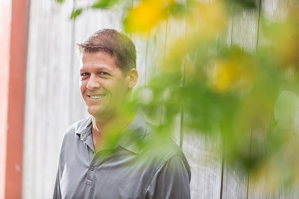 istock Mature man standing outdoors smiling at camera 468909304