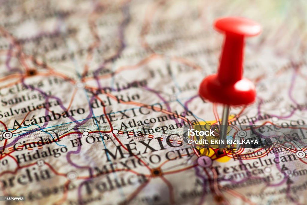 Mexico City Pinned on Map Close up shot of a map. Mexico City pinned with a red pushpin.  Mexico City is the federal district, capital of Mexico. 2015 Stock Photo