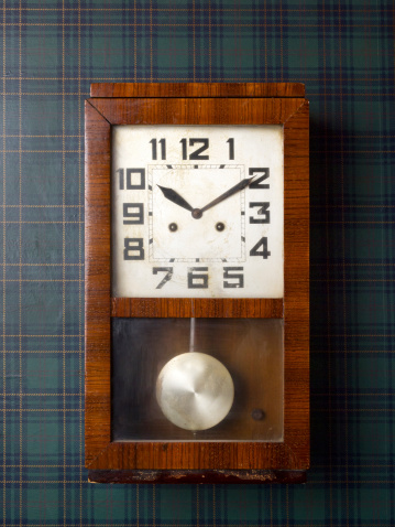 Vintage clock on wall reads ten past ten. Clipping path included for easy change background.