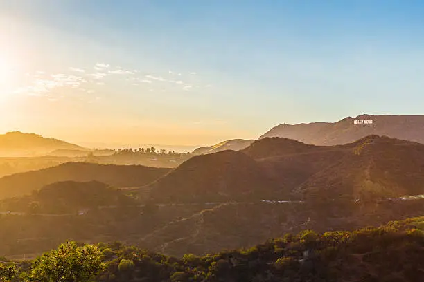 Sunset over the Hollywood Hills showing the Hollwood sign on a beautiful evening.