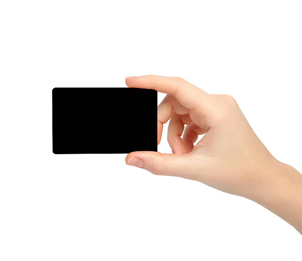 istock womans hand holding a black card 468911305
