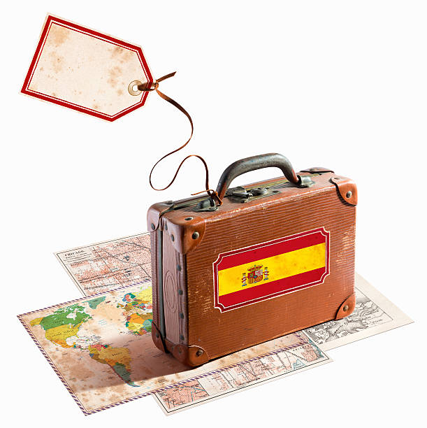 istock Antique leather suitcase on different maps Spain Flag 468911575