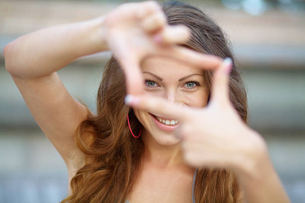istock Closeup of young beautiful woman making frame with her hands 468912193