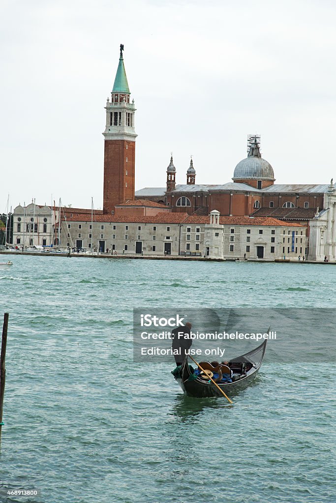 Gondola at Venice Venice, Italy - April 18, 2014: A  gondolier carries on its gondola tourists to the island of Giudecca 2015 Stock Photo