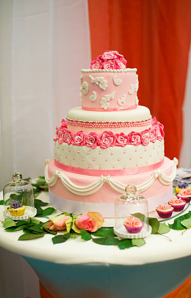 istock Wedding cake decorated with pink roses 468914145