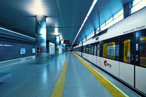 Valencia, Spain - January 14, 2014: Train on airport station in Valencia. Metrovalencia - large suburban network crosses the whole city, consists more than 134 km of track of which 19km is below the ground.