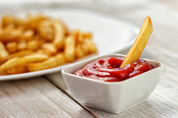 Ketchup with french fries dipped 
