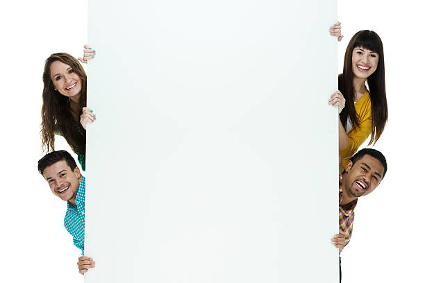 istock Four friends hiding behind placard 468917468