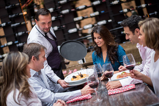istock Waiter serving food at a restaurant 468917804
