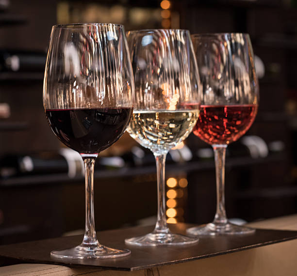 istock Three glasses of wine: red, white and rose 468917818