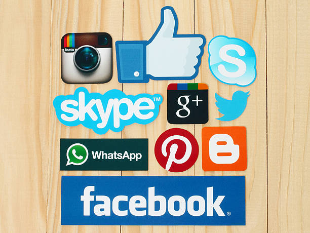 Collection of popular social media logos Kiev, Ukraine - February 19, 2015:Collection of popular social media logos printed on paper:Facebook, Twitter, Google Plus, Instagram, Skype, WhatsApp, Pinterest and Blogger on wooden background pinterest stock pictures, royalty-free photos & images
