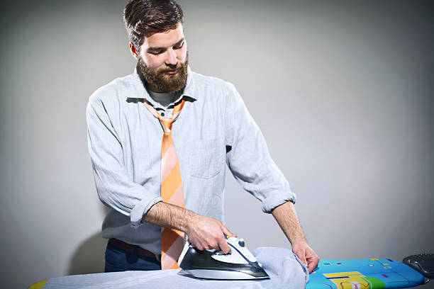 istock Ironing is not a man's job. 468919088