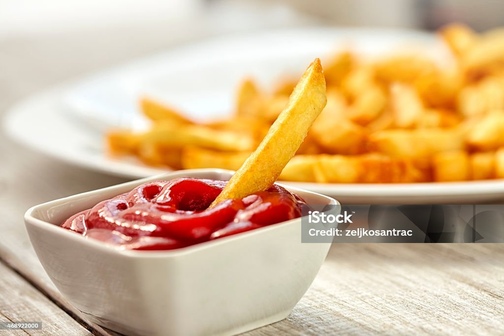 Ketchup with french fries Ketchup with french fries dipped  Ketchup Stock Photo