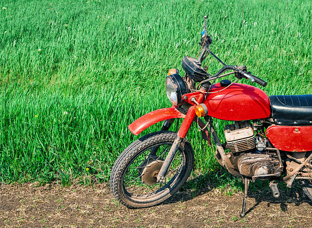 istock Classic old motorcycle on a dirt road. 468922180
