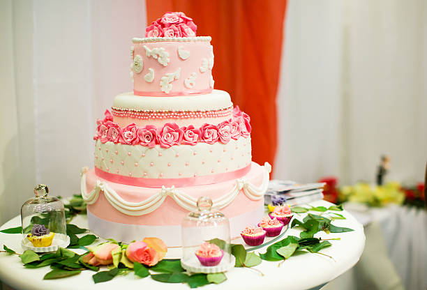 istock Wedding cake decorated with pink roses 468922355