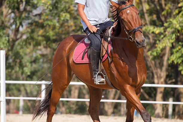 istock man riding horse 468922393