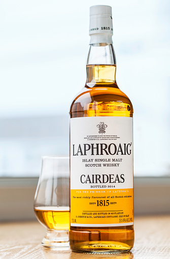 Dartmouth, Nova Scoti, Canada - April 4, 2015: Laphroaig Cairdeas 2014 Single Malt Whisky with Glencairn whisky glass on a table.  The 2014 Cairdeas for 2014 is a matured in ex-bourbon casks then in Amontillado hogsheads.  