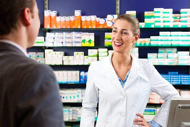 istock Female pharmacist consulting a customer in pharmacy 468928063