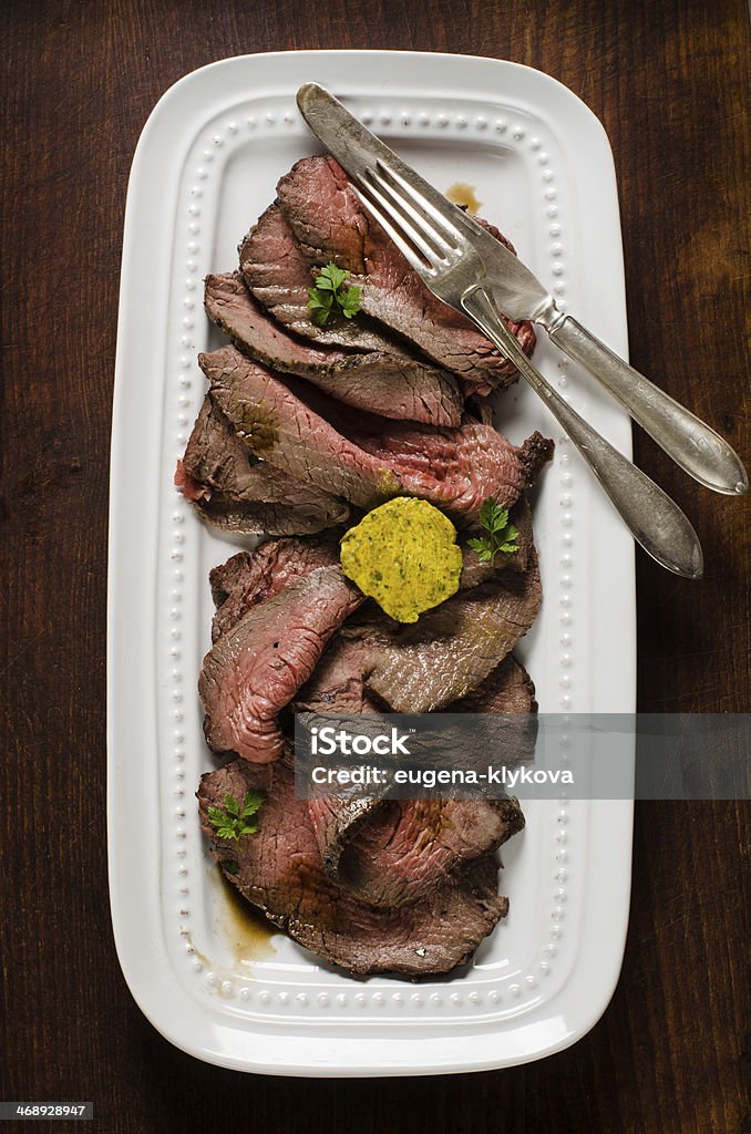 Juicy roast beef slices Juicy roast beef slices on cutting board Barbecue - Meal Stock Photo