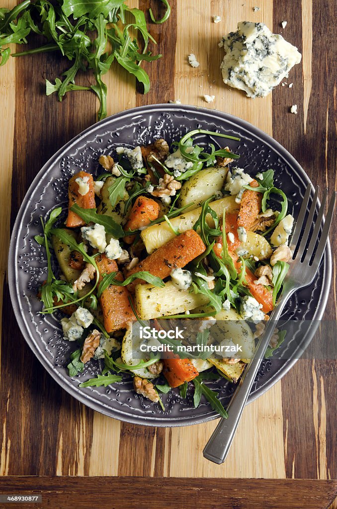 Roasted root and rocket salad Salad made of roasted vegetables, rocket, Stilton and walnuts Nut - Food Stock Photo