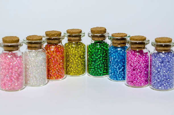 istock small glass jar's with arts and craft coloured beads 468931008