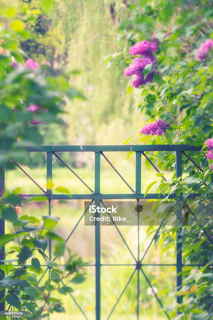 Hidden garden gate Wonderful garden scene 2015 Stock Photo