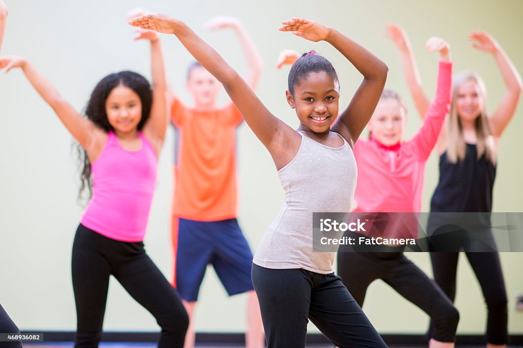 Young Children Practicing Dance A diverse group of children learning choreography in a dance class. Child Stock Photo