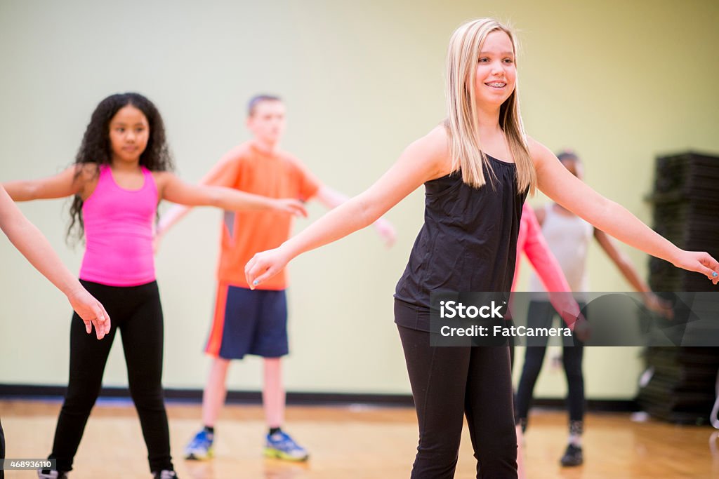 Dance Lessons for Children A diverse group of children learning choreography in a dance class. Adolescence Stock Photo