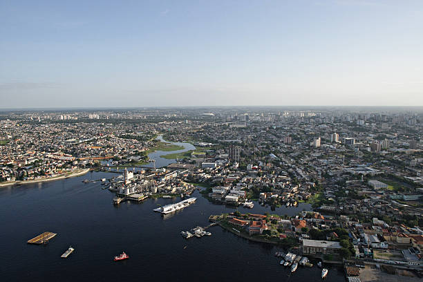 Aerial view of the city of Manaus in Brazil Aerial view of manaus city center, showing the area of modern manaus and the Negro River. rio negro brazil stock pictures, royalty-free photos & images