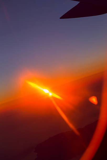 Sunset sky view over the wing of plane