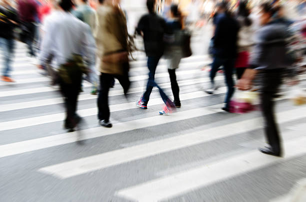 People walking on big city street stock photo